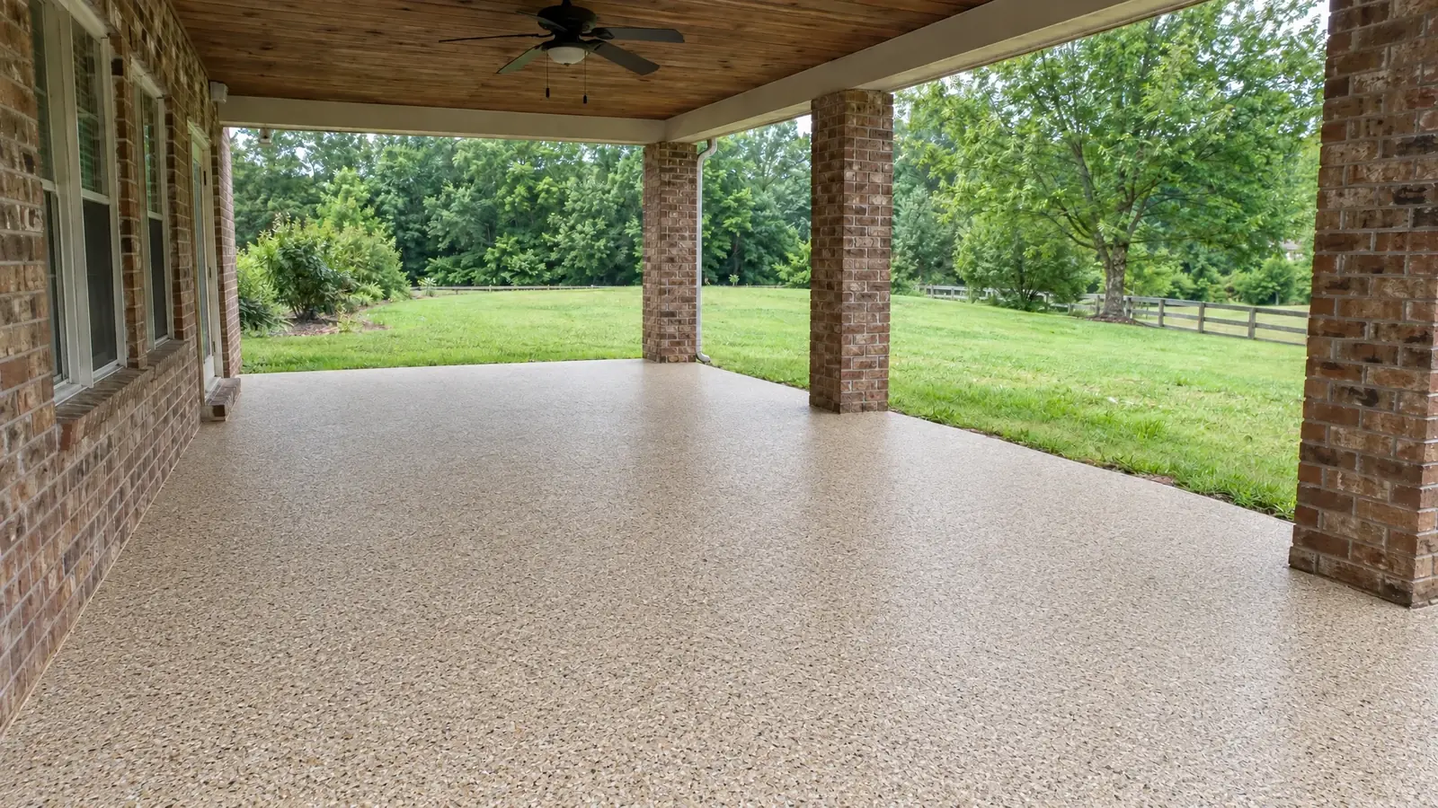 The same patio and porch after installing a tan quartz polyaspartic coating